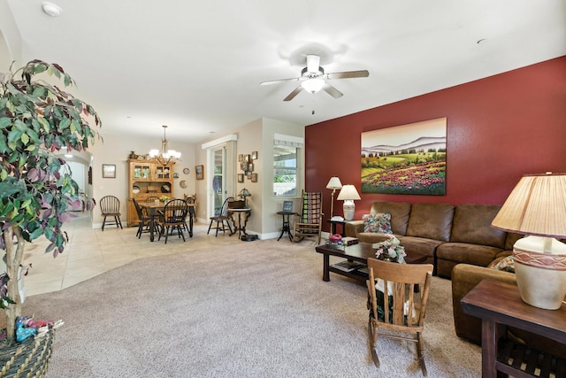 5822 E Booker Ave, Fresno, CA 93727 - carpeted living area with ceiling fan, a chandelier, and tile patterned floors