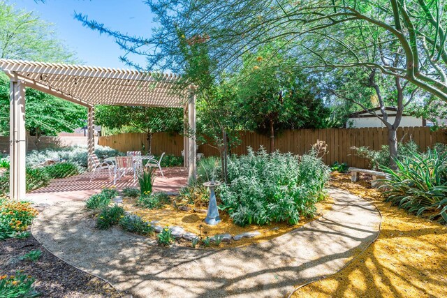 5822 E Booker Ave, Fresno, CA 93727 - fenced backyard with a pergola and a patio