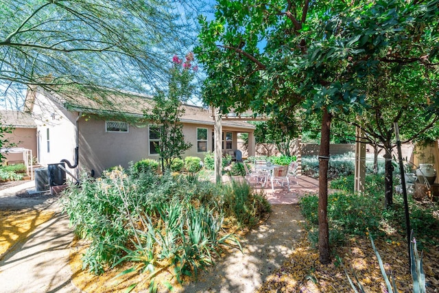 5822 E Booker Ave, Fresno, CA 93727 - back of property featuring stucco siding and a patio