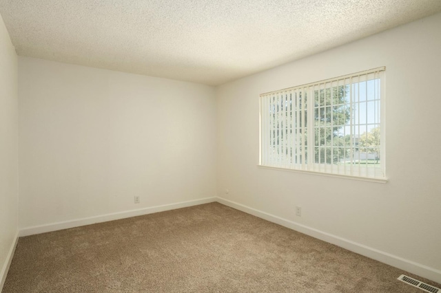486 W Alamos Ave Unit 3, Clovis, CA 93612 - spare room featuring carpet flooring and a textured ceiling