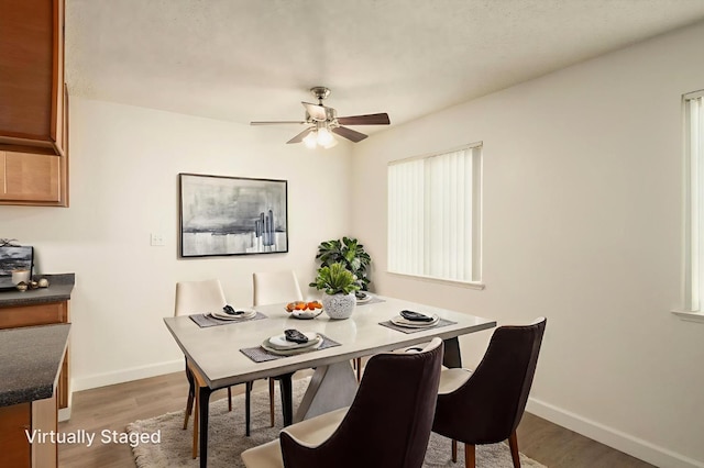 486 W Alamos Ave Unit 3, Clovis, CA 93612 - dining room with light wood-type flooring and a ceiling fan