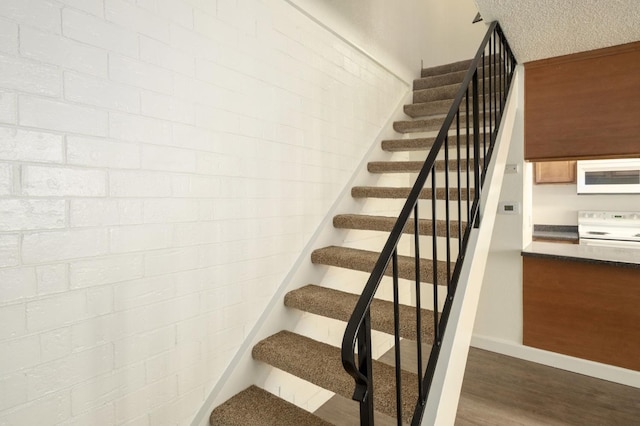 486 W Alamos Ave Unit 3, Clovis, CA 93612 - stairs with wood finished floors and baseboards