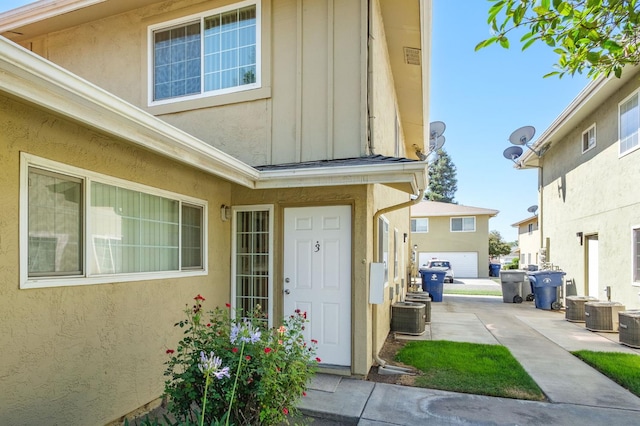 486 W Alamos Ave Unit 3, Clovis, CA 93612 - doorway to property featuring board and batten siding and stucco siding