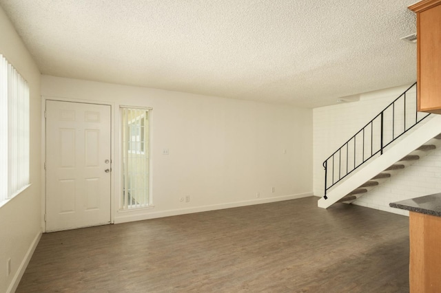 486 W Alamos Ave Unit 3, Clovis, CA 93612 - foyer featuring dark wood finished floors, a textured ceiling, and stairs