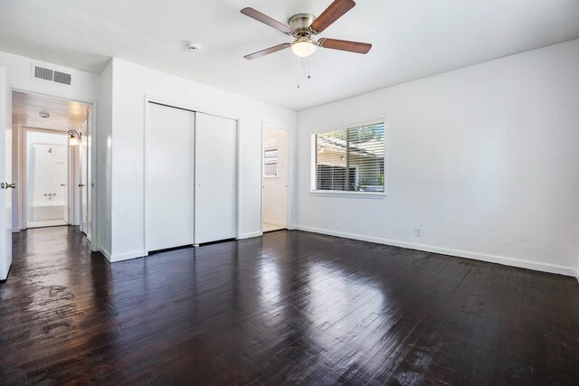 3677 N Thesta St, Fresno, CA 93726 - unfurnished bedroom featuring dark wood-style floors, a closet, and ceiling fan