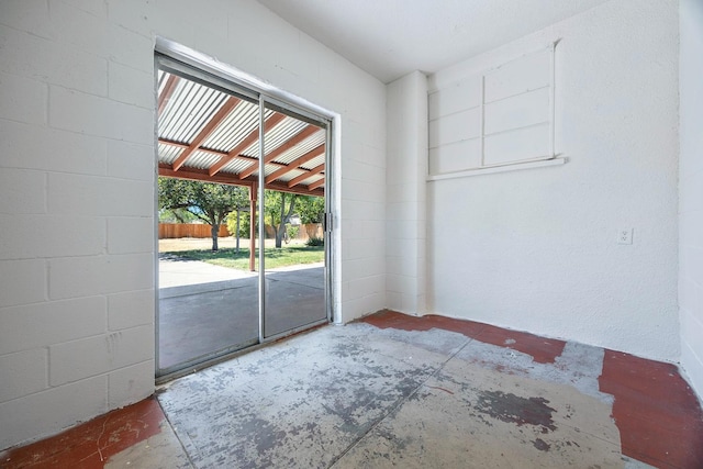 3677 N Thesta St, Fresno, CA 93726 - spare room featuring concrete block wall