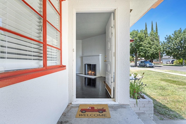 3677 N Thesta St, Fresno, CA 93726 - property entrance featuring stucco siding and a lawn