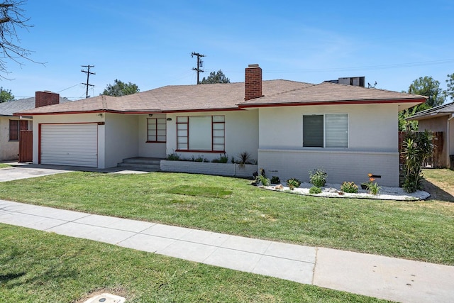 3677 N Thesta St, Fresno, CA 93726 - ranch-style home with a chimney, an attached garage, a front lawn, concrete driveway, and brick siding