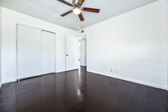 3677 N Thesta St, Fresno, CA 93726 - unfurnished bedroom featuring dark wood-style flooring, a closet, and a ceiling fan