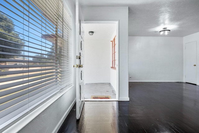 3677 N Thesta St, Fresno, CA 93726 - hall with wood finished floors and a textured ceiling