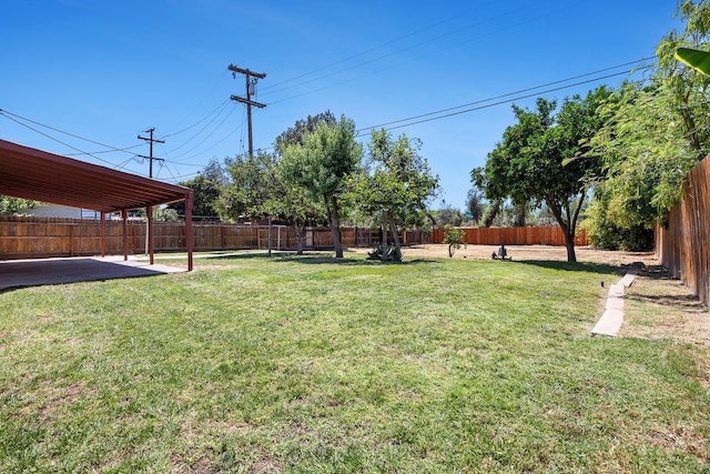 3677 N Thesta St, Fresno, CA 93726 - fenced backyard with a patio area