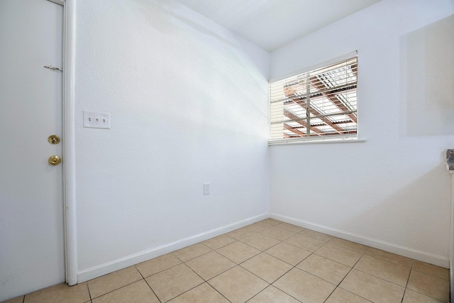 3677 N Thesta St, Fresno, CA 93726 - empty room with baseboards and light tile patterned flooring