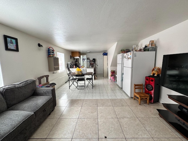 1925 E 15th, Oakland, CA 94606 - living room with a textured ceiling and light tile patterned floors
