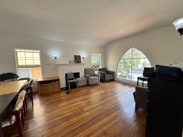 1925 E 15th, Oakland, CA 94606 - living area with dark wood-style flooring, a fireplace, and vaulted ceiling