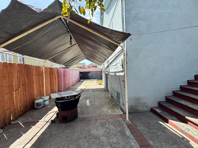 1925 E 15th, Oakland, CA 94606 - view of property exterior with a fenced backyard and a patio area