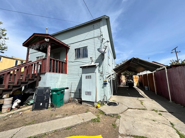 1925 E 15th, Oakland, CA 94606 - back of house with concrete driveway and a detached carport