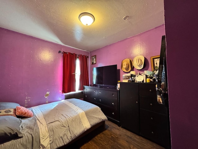 1925 E 15th, Oakland, CA 94606 - bedroom featuring a textured ceiling and dark wood-style floors