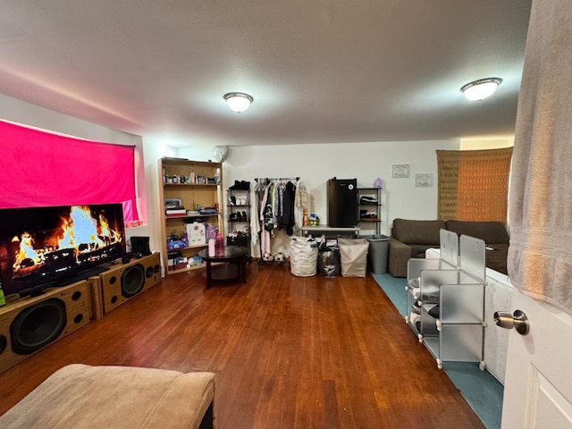 1925 E 15th, Oakland, CA 94606 - living area with wood finished floors and a warm lit fireplace