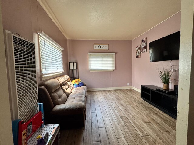 1925 E 15th, Oakland, CA 94606 - living area featuring wood finished floors, a heating unit, and ornamental molding
