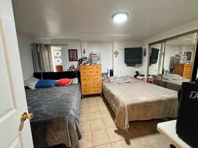 1925 E 15th, Oakland, CA 94606 - bedroom featuring light tile patterned flooring and a closet