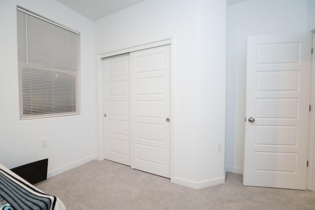 5769 W Austin Way, Fresno, CA 93722 - unfurnished bedroom with light carpet and a closet