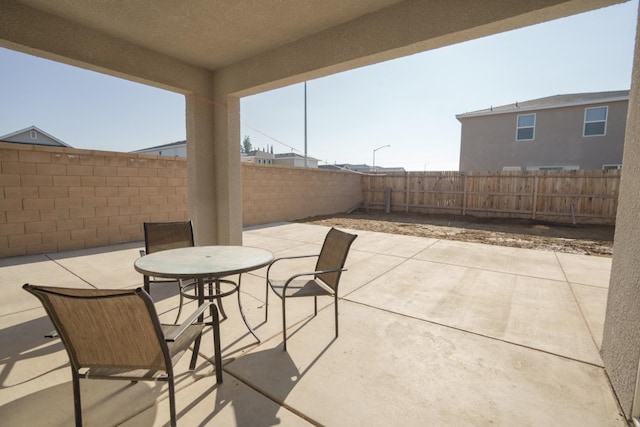5769 W Austin Way, Fresno, CA 93722 - fenced backyard with a patio and outdoor dining area