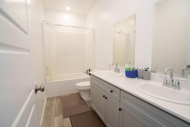 5769 W Austin Way, Fresno, CA 93722 - full bath featuring double vanity, shower / bath combo, and wood finished floors