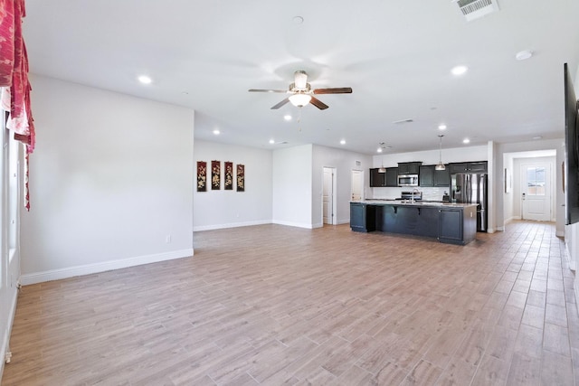 2456 Junipero Ave, Clovis, CA 93619 - unfurnished living room featuring ceiling fan, recessed lighting, and light wood-style flooring