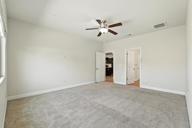 2456 Junipero Ave, Clovis, CA 93619 - unfurnished bedroom featuring carpet floors, ensuite bathroom, and a ceiling fan