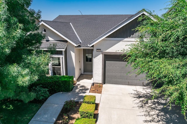 2456 Junipero Ave, Clovis, CA 93619 - view of front of house with a garage, driveway, a shingled roof, and stucco siding