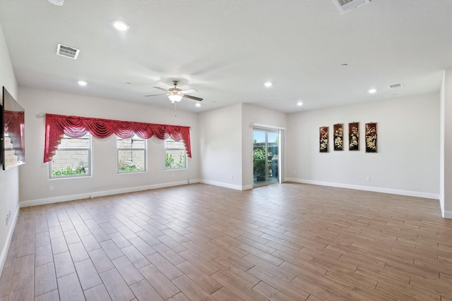 2456 Junipero Ave, Clovis, CA 93619 - spare room featuring ceiling fan, wood finished floors, and recessed lighting