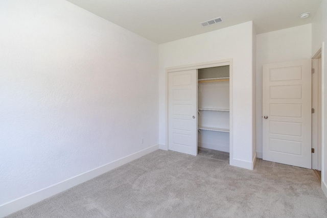 153 N Bliss Ave, Fresno, CA 93727 - unfurnished bedroom with light colored carpet and a closet