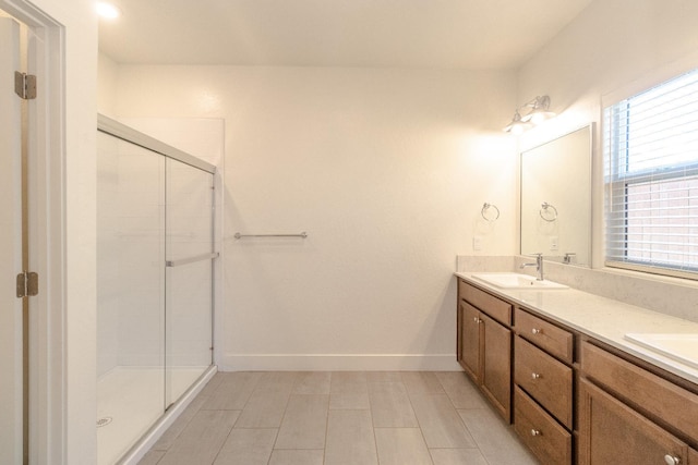 153 N Bliss Ave, Fresno, CA 93727 - full bath with double vanity, a shower stall, and tile patterned floors