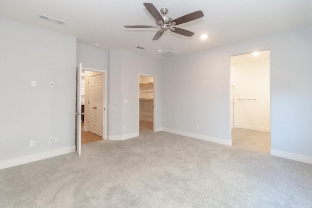 153 N Bliss Ave, Fresno, CA 93727 - unfurnished bedroom featuring light carpet, a spacious closet, connected bathroom, recessed lighting, and a ceiling fan
