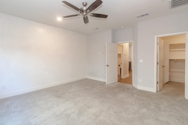 153 N Bliss Ave, Fresno, CA 93727 - unfurnished bedroom featuring a spacious closet, light colored carpet, a ceiling fan, and a closet