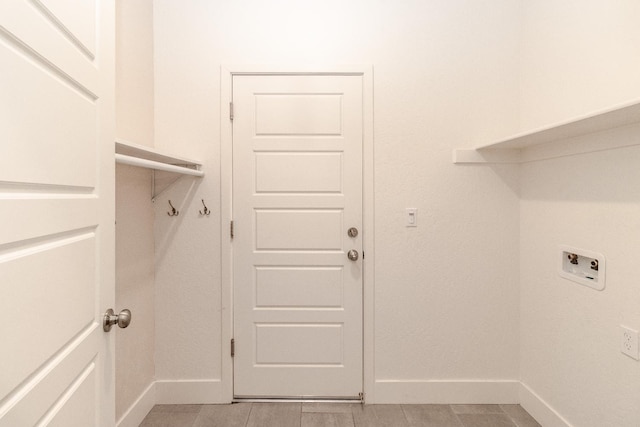 153 N Bliss Ave, Fresno, CA 93727 - laundry room featuring baseboards and hookup for a washing machine