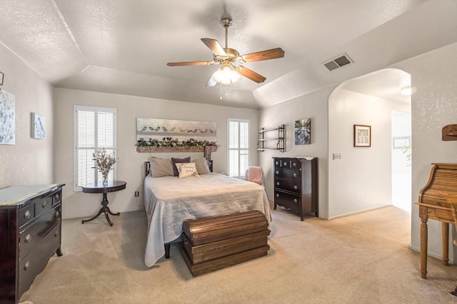 1785 E Portland Ave, Fresno, CA 93720 - bedroom with arched walkways, light carpet, and ceiling fan