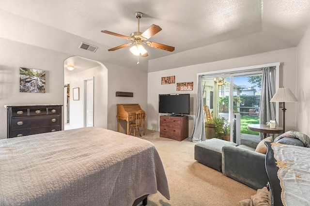 1785 E Portland Ave, Fresno, CA 93720 - bedroom featuring access to exterior, light colored carpet, arched walkways, lofted ceiling, and ceiling fan