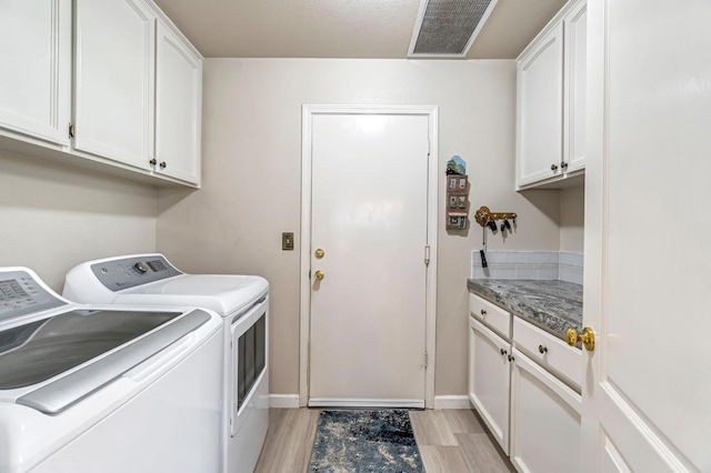 1785 E Portland Ave, Fresno, CA 93720 - laundry room with independent washer and dryer, cabinet space, and light wood-style floors