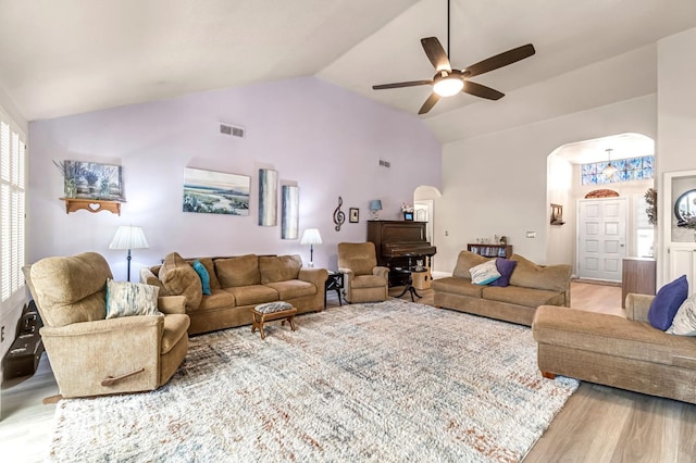 1785 E Portland Ave, Fresno, CA 93720 - living area with arched walkways, light wood-style flooring, a ceiling fan, and high vaulted ceiling