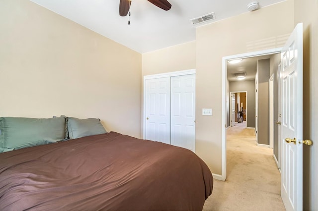 205 N Douglas Ave, Fresno, CA 93727 - bedroom featuring light colored carpet, a closet, and ceiling fan