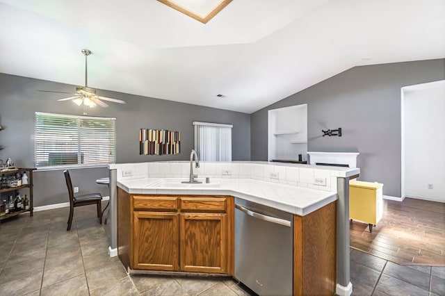 205 N Douglas Ave, Fresno, CA 93727 - kitchen featuring stainless steel dishwasher, vaulted ceiling, a ceiling fan, open floor plan, and brown cabinets