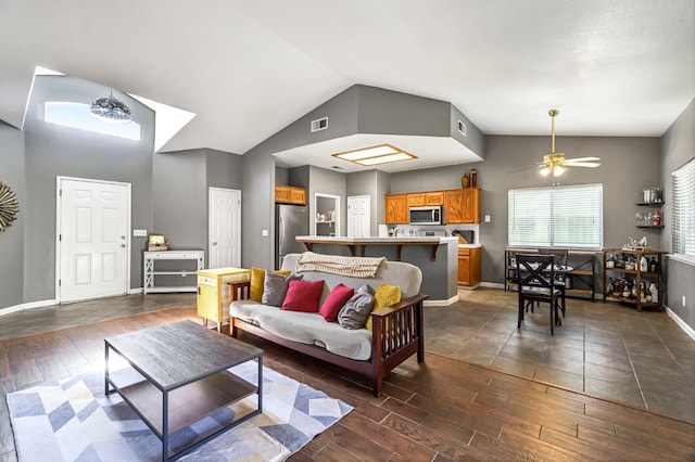 205 N Douglas Ave, Fresno, CA 93727 - living area with lofted ceiling, dark wood finished floors, and ceiling fan