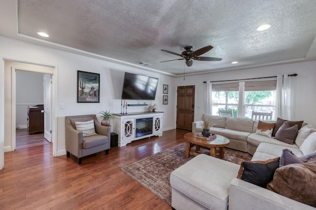 3054 E Brown Ave, Fresno, CA 93703 - living room featuring a textured ceiling, a ceiling fan, wood finished floors, and recessed lighting