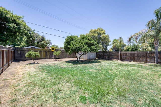 3054 E Brown Ave, Fresno, CA 93703 - fenced backyard featuring a storage shed