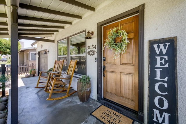 3054 E Brown Ave, Fresno, CA 93703 - view of exterior entry with a porch and stucco siding