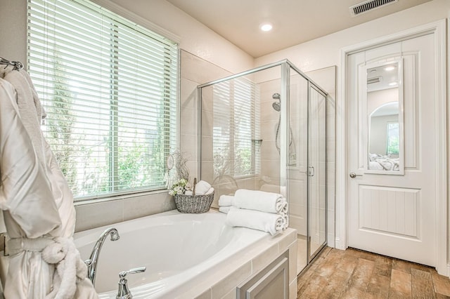 1363 E Via Prato Dr, Fresno, CA 93730 - full bathroom with a bath, a stall shower, and wood finished floors