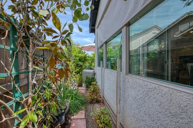 1363 E Via Prato Dr, Fresno, CA 93730 - view of side of property featuring stucco siding and a central air condition unit