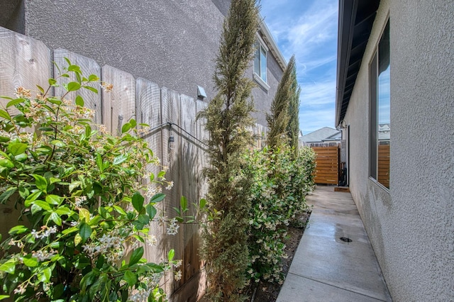 1363 E Via Prato Dr, Fresno, CA 93730 - view of side of property with stucco siding