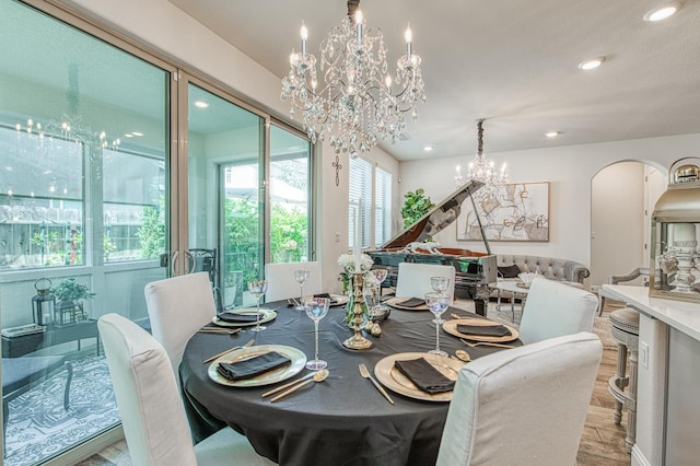 1363 E Via Prato Dr, Fresno, CA 93730 - dining room featuring a chandelier, recessed lighting, and arched walkways